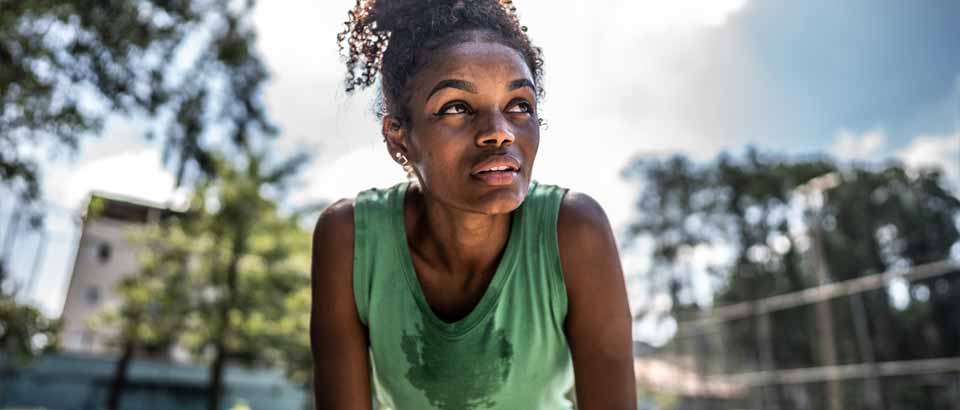 a women catching her breath working out